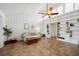 Stylish living room features vaulted ceiling, built-in shelving and sliding doors to the balcony at 211 Crown Oaks Way # 205, Longwood, FL 32779
