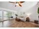 Cozy living room with natural light, neutral tones, and a sliding door to the balcony at 211 Crown Oaks Way # 205, Longwood, FL 32779