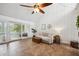 Cozy living room with natural light, neutral tones, and a sliding door to the balcony at 211 Crown Oaks Way # 205, Longwood, FL 32779