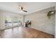 Office space with brick accent wall and sliding glass doors leading to balcony at 211 Crown Oaks Way # 205, Longwood, FL 32779