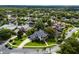 Gorgeous aerial view of home on a cul-de-sac with backyard waterfront access to a lake in a lush green community at 213 N Monterey Isle, Longwood, FL 32779