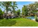 Spacious backyard with pool, dock, and waterfront access for boating at 213 N Monterey Isle, Longwood, FL 32779