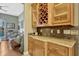 Stylish bar area featuring custom cabinetry, a wine rack, and countertop seating at 213 N Monterey Isle, Longwood, FL 32779