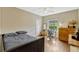 Comfortable bedroom featuring modern furnishings and a dedicated workspace area at 213 N Monterey Isle, Longwood, FL 32779