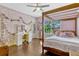 Charming bedroom boasts a four-poster bed and whimsical string lights at 213 N Monterey Isle, Longwood, FL 32779
