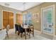 Charming dining room featuring a modern light fixture and ample natural light at 213 N Monterey Isle, Longwood, FL 32779