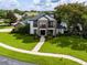 Beautiful two-story home featuring a well-manicured front yard at 213 N Monterey Isle, Longwood, FL 32779