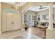 Inviting foyer with tile and wood flooring, arched entryways, and a view into the adjacent living area at 213 N Monterey Isle, Longwood, FL 32779