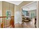 Hallway view of bedroom with ensuite and sliding glass doors to outdoor terrace at 213 N Monterey Isle, Longwood, FL 32779