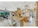 A spacious kitchen features granite countertops, a large island with seating, and stainless steel appliances at 213 N Monterey Isle, Longwood, FL 32779
