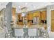 Spacious kitchen with a large granite island and stainless steel appliances, perfect for cooking and entertaining at 213 N Monterey Isle, Longwood, FL 32779