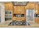 A kitchen with a stainless steel refrigerator, and a built-in microwave and oven at 213 N Monterey Isle, Longwood, FL 32779