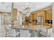 Bright kitchen with a large island, stainless steel appliances, and counter seating at 213 N Monterey Isle, Longwood, FL 32779