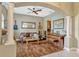 Cozy living room with hardwood floors, neutral color scheme, and comfortable seating arrangement at 213 N Monterey Isle, Longwood, FL 32779
