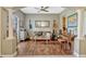 Comfortable living room with hardwood floors, ceiling fan, and stylish decor creating a cozy atmosphere at 213 N Monterey Isle, Longwood, FL 32779