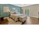 A beautifully decorated main bedroom with a large bed, ensuite and terrace access at 213 N Monterey Isle, Longwood, FL 32779