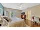 A beautifully decorated main bedroom with a large bed, and access to an outdoor terrace at 213 N Monterey Isle, Longwood, FL 32779