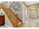A carpeted staircase with wooden banisters and a gallery wall of Gathering photos at 213 N Monterey Isle, Longwood, FL 32779