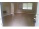 An expansive living room is shown with tile flooring and plenty of natural light from the windows at 2260 Willie Mays Pkwy, Orlando, FL 32811