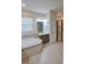 Bright bathroom featuring a soaking tub, walk-in shower and double sink vanity at 2390 Standing Rock Cir, Oakland, FL 34787