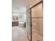 Bathroom featuring a walk-in shower, bathtub, vanity with dual sinks and stone countertops at 2390 Standing Rock Cir, Oakland, FL 34787