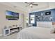 Cozy bedroom featuring a fireplace, TV, and large windows that offer plenty of natural light at 2390 Standing Rock Cir, Oakland, FL 34787