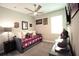 Sports themed bedroom with ceiling fan, TV, an abundance of natural light, and carpeted floors at 2390 Standing Rock Cir, Oakland, FL 34787