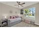 Well-lit bedroom with a comfortable daybed, stylish decor, and a view from the window at 2390 Standing Rock Cir, Oakland, FL 34787