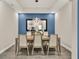 The dining room features modern decor and a stylish light fixture, creating an inviting space for meals at 2390 Standing Rock Cir, Oakland, FL 34787