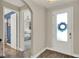 Charming entryway with a frosted glass door and glimpses of the home's modern, open layout at 2390 Standing Rock Cir, Oakland, FL 34787