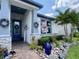 Charming entry showcases a decorative door, stone accents, lush landscaping, and a welcoming aesthetic at 2390 Standing Rock Cir, Oakland, FL 34787