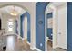 Arched hallway with wood-style flooring, and access to other rooms at 2390 Standing Rock Cir, Oakland, FL 34787