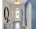 Inviting hallway featuring arched doorways, decorative lighting, and elegant accents creating a seamless transition throughout at 2390 Standing Rock Cir, Oakland, FL 34787