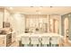 Bright kitchen features a large island, stainless appliances, and white cabinetry at 2390 Standing Rock Cir, Oakland, FL 34787