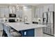 Modern kitchen with large island, stainless steel appliances, and ample counter space at 2390 Standing Rock Cir, Oakland, FL 34787
