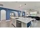 Stylish kitchen boasts a large island, stainless appliances, and an open layout at 2390 Standing Rock Cir, Oakland, FL 34787