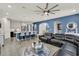 Open-concept living space with a modern kitchen, comfortable seating, and stylish decor for seamless entertaining at 2390 Standing Rock Cir, Oakland, FL 34787