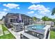 Stunning outdoor space featuring a screened pool, grill area, and ample seating for entertaining at 2390 Standing Rock Cir, Oakland, FL 34787