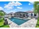 Inviting pool area with screened enclosure, outdoor dining, and lounging spaces for relaxation at 2390 Standing Rock Cir, Oakland, FL 34787