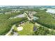 Community aerial shot showing a park, baseball field, lakes, tennis courts, and lush landscaping at 2418 Ridgemooor Dr, Orlando, FL 32828