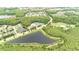 Sprawling aerial view featuring lakes, sports courts, and community amenities at 2418 Ridgemooor Dr, Orlando, FL 32828