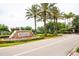 Stoneybrook Community entrance sign with lush landscaping and palm trees at 2418 Ridgemooor Dr, Orlando, FL 32828