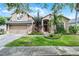 Charming two-story home with a well-maintained lawn and inviting curb appeal at 2418 Ridgemooor Dr, Orlando, FL 32828