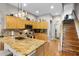 Well-lit kitchen with granite countertops, stainless steel appliances, and plenty of cabinet space at 2418 Ridgemooor Dr, Orlando, FL 32828