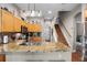 Modern kitchen with granite counters, stainless appliances, wood floors, and a convenient island for food prep and entertaining at 2418 Ridgemooor Dr, Orlando, FL 32828