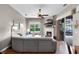 Comfortable living room boasting a fireplace, wood floors, large windows, and sliding door access to the outdoor space at 2418 Ridgemooor Dr, Orlando, FL 32828