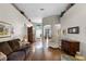 Bright living room with hardwood floors and decor shelves, ideal for relaxing or entertaining guests at 2418 Ridgemooor Dr, Orlando, FL 32828