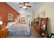 Spacious main bedroom with warm tones, plush carpet, and a king-sized bed, creating a cozy and inviting retreat at 2418 Ridgemooor Dr, Orlando, FL 32828
