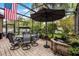 Relaxing screened-in patio with stone flooring and views of the beautifully landscaped backyard at 2418 Ridgemooor Dr, Orlando, FL 32828