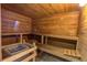 Relaxing wooden sauna with multiple seating benches and a heater at 2418 Ridgemooor Dr, Orlando, FL 32828